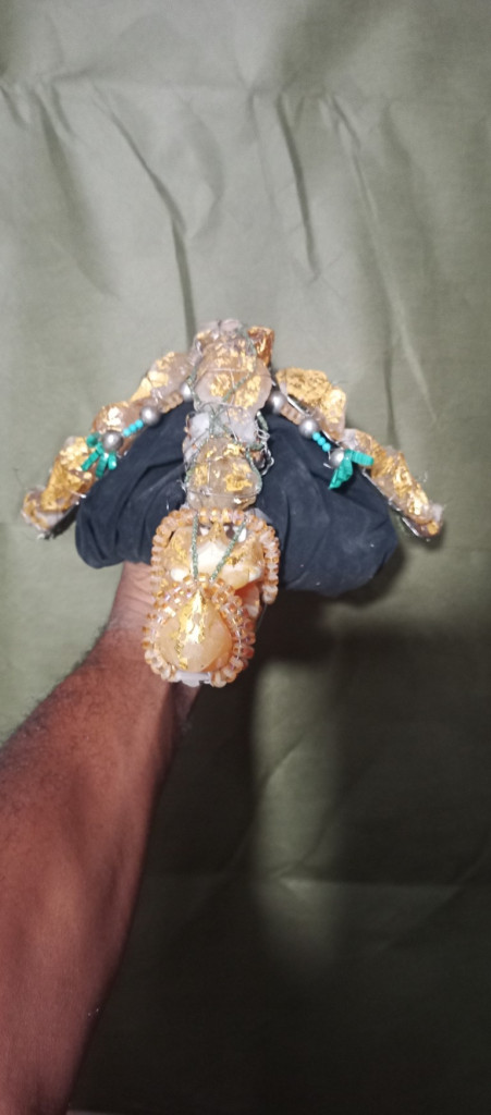 Clothing, Footwear, Sandal, Accessories, Jewelry, Diamond, Gemstone, Animal, Food, Invertebrate, Lobster, Sea Life, Seafood, Bracelet, Glove, Flip-Flop, Ring, Body Part, Finger, Hand, Person, Ornament, Earring, Cuff, Aluminium, Crystal, Wristwatch, Face, Head, Photography, Portrait, Turquoise, Sapphire, Bangles, Treasure, Gold, Silver, Foil, Anklet, Henna, Necklace