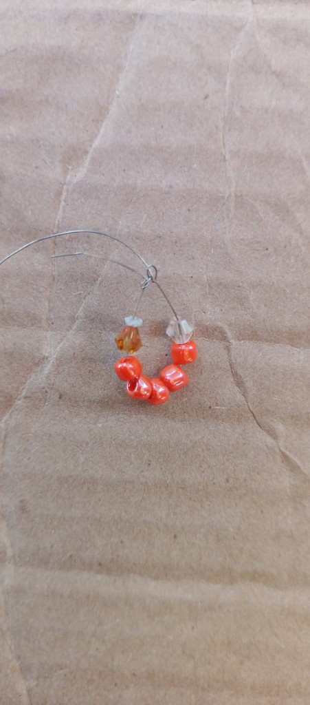 Accessories, Earring, Jewelry, Bead, Gemstone, Necklace, Ornament, Food, Produce, Fruit, Plant, Bead Necklace, Sweets, Box, Prayer, Prayer Beads, Coil, Spiral, Agate, Cardboard, Weapon, Bracelet, Sphere, Pepper, Vegetable, Crystal, Carton, Leaf, Maple, Tree, Silver, Candy, Wood