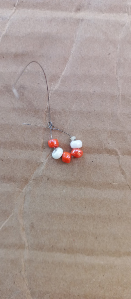 Accessories, Earring, Jewelry, Bead, Necklace, Outdoors, Food, Sweets, Nature, Weather, Gemstone, Medication, Sphere, Ornament, Cardboard, Ball, Golf, Golf Ball, Sport, Box, Prayer, Prayer Beads, Rock, Silver, Pebble, Carton, Candy, Produce, Balloon, Pill, Sand, Soil, Fruit, Plant, Wood, Agate, Collar, Crystal, Animal, Invertebrate, Spider