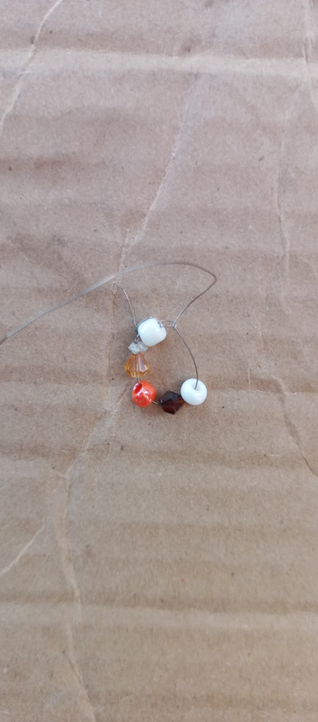 Accessories, Bead, Earring, Jewelry, Outdoors, Nature, Necklace, Wood, Cardboard, Animal, Invertebrate, Spider, Box, Food, Fruit, Plant, Produce, Sand, Soil, Carton, Sphere, Ornament, Sweets, Beak, Bird, Weather, Beach, Coast, Sea, Shoreline, Water, Bead Necklace, Rock, Gemstone, Grain, Floor, Leaf, Figurine, Bee, Insect, Wasp, Sea Life, Seashell, Prayer, Prayer Beads, Bud, Flower, Sprout, Ball, Golf, Golf Ball, Sport, Home Decor, Linen, Green, Balloon, Cricket Insect, Flooring, Seafood, Petal, Hole, Mineral, Desert, Seed, Dune, Coil, Spiral, Crystal, Pebble, Art, Porcelain, Pottery