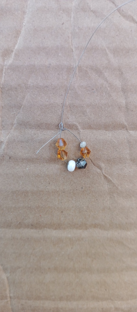 Accessories, Earring, Jewelry, Necklace, Gemstone, Bead, Ornament, Crystal, Box, Cardboard, Outdoors, Nature, Diamond, Pendant, Mineral, Carton, Ball, Golf, Golf Ball, Sport, Animal, Invertebrate, Sea Life, Seashell, Wood, Floor, Pearl, Spider, Cross, Symbol, Silver, Sphere, Home Decor, Linen, Collar, Flooring, Bead Necklace, Prayer, Prayer Beads, Quartz, Weather, Rock, Locket, Opal